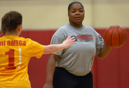 Women's basketball graduate assistant Tonya Tuggles scans the court during an intramural basketball game.