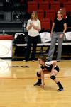 Jami Humphries, junior media communications major, prepares for the serve during a match against the University of West Florida. - Photo by Anne Richoux