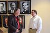 Jerry Tidwell, senior vice president for university relations, talks with Josh Clarke, director of alumni relations, outside the Carl Grant Event Center during the President's Brunch. - Photo by Zac Calvert