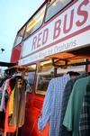 Students and families had the opportunity to take part in the Red Bus Project by donating or shopping for clothes on the big red bus at Union Night during Family Weekend. - Photo by Anne Richoux