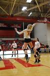 Mallory Baker, freshman business administration major, prepares to spike the ball during a match against University of Alabama-Huntsville. - Photo by Zac Calvert