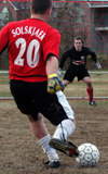 Onion goalkeeper Patrick Myers braces himself for Jacob O'Brien's shot during an intramural soccer game. - Photo by Jonathan Blair