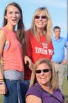 Lindsey Chesak, Cheryl Chesak, and Justine Stump cheer and watch intramural games during Family Weekend. - Photo by Zac Calvert