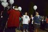Homicide-loss survivors receive white balloons at the fifth annual Remember Me Commemorative Walk. The balloons were released in honor of lost loved ones. - Photo by Jacob Moore