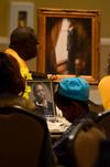 Families sit at tables with pictures of their lost loved ones during the fifth annual Remember Me Commemorative Walk. - Photo by Jacob Moore