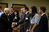 Former Secretary of Defense Robert M. Gates shakes hands with Wil Story, senior psychology major, during a reception before the 15th Annual Scholarship Banquet.  - Photo by Anne Richoux