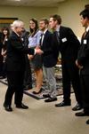 SAC president Jeff Thompson, senior digital media studies major, introduces himself to Former Secretary of Defense Robert M. Gates during a reception before the 15th Annual Scholarship Banquet.  - Photo by Anne Richoux