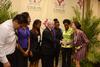Claudia Velasco, senior accounting major, and friends greet Robert M. Gates, former U.S. secretary of defense, after the 15th Annual Scholarship Banquet. - Photo by Jacob Moore