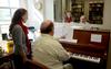 Crystal Jones, senior music education major, rehearses with Michael Penny, professor of music, to prepare for her senior recital.  - Photo by Ebbie Davis