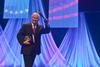 Robert M. Gates, former U.S. secretary of defense,  waves farewell to the audience at the 15th Annual Scholarship Banquet. - Photo by Morris Abernathy