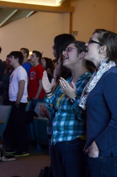 Christine Ryan, junior Christian studies major, and Cari Phillips, sustainability coordinator, sing along during worship in the final chapel of Faith in Practice week. 