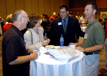 Senior Vice President for University Relations Charles Fowler (center) enjoys a light moment with a few friends at the SBC Alumni and Friends Dessert Reception.  Pictured from left to right: Dr. Jerry Winfield, Carolyn Priest, Dr. Fowler and Dr. Mike Priest.