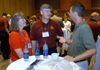 Former Missionaries-in-Residence Dottie and Steve Babcock (left) fellowship with Dr. Mike Priest at the SBC Alumni and Friends Dessert Reception.
 - Photo by Jim Veneman