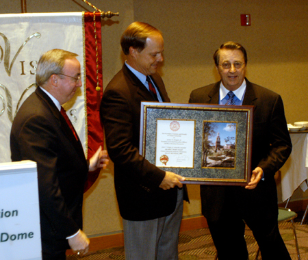LifeWay Christian Resources President James T. Draper accepts the M.E. Dodd Award from Mike Weeks, chairman of Union's Board of Trustees, and President David S. Dockery. The award was presented at the Alumni and Friends Dessert Reception June 15 at the Southern Baptist Convention in Indianapolis, Ind. More than 200 attended the event. 