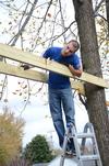 Dylan Baker, junior engineering major, works on building a swing set for the East Chester site of Mission Jackson, an outreach program of Englewood Baptist Church, during Campus and Community Day.  - Photo by Anne Richoux