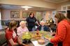Students talk with residents at Alexandria Place, an assisted living home, during Campus and Community Day.  - Photo by Anne Richoux