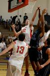 Eric Leisey fights for the rebound against Central Baptist College players during the season opener, which the Bulldogs won 86-70.  - Photo by Anne Richoux