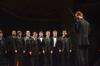The men's choir, led by Chris Mathews, associate professor of music, sings "Ding! Ding! Merrily on High" in the annual Christmas program in the chapel. - Photo by Zac Calvert