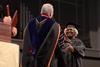 Roxie Jackson, associate of divinity, accepts her diploma from David S. Dockery, president of the university, during Fall Commencement. - Photo by Jacob Moore