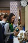 Rebecca Blevins, junior biology major, admires a cup on sale in the Student Union Building during the annual Christmas pottery sale. - Photo by Zac Calvert