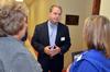 Jim Avery, associate vice president for information technology, talks to faculty members before giving a presentation at the beginning of the Fall semester.  - Photo by Morris Abernathy