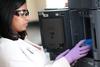 Lida Thimothy, pharmacy student, works in the lab. - Photo by Kristi McMurry