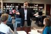 Hal Poe, Charles Colson professor of faith & culture, chats with students in the Ryan Center library. - Photo by Kristi McMurry