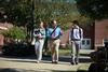 Scott Huelin, associate professor of English and director of the honors community, walks across campus with students. - Photo by Kristi McMurry