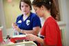 Nursing students prepare tools for a simulation lab session.  - Photo by Kristi McMurry