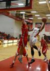 Bulldog AJ Roberts goes up for a shot against Christian Brothers' Michael Drake during a home game. - Photo by Jacob Moore