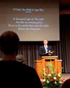 Chris Mathews, associate professor of music and department chair, leads in singing <em>O God, Our Help in Ages Past</em> during Homecoming chapel. - Photo by Olivia Wallace