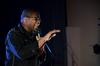 Comedian Bone Hampton performs during the Homecoming concert in the Savage Chapel. - Photo by Anne Richoux