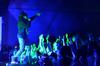 The crowd sings along as hip hop artist Dee-1 performs during the Homecoming concert. - Photo by Anne Richoux