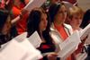 Kelsey McFarland, junior music and psychology double major, and Mollie Greenlee, senior music major, practice with University Singers in Hartley Recital Hall.  - Photo by Anne Richoux