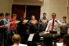 The University Singers practice under the direction of Chris Mathews, associate professor of music and department chair. - Photo by Anne Richoux