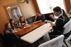 Emily Lean, assistant professor of management, hosts Megan Kersey, Ruth Bone, Kristen Miller and Mark Kartzinel at her home for pizza and a game of charades during Be Our Guest.  - Photo by Matt McDaniel