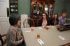 Alice Nettles, wife of physics department chair Bill Nettles, talks with students Rebecca Blevins, Samantha Adams, and Ryan Linkous. Bill and Alice Nettles welcomed students into their home for dinner as a part of SAC's Be Our Guest. - Photo by Anne Richoux