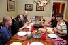 Grace Morriss, junior engineering major, Ryan Harris, freshman engineering major, and Ward Howard, physics and math double major, enjoy dinner with Georg Pingen (right), assistant professor of engineering, and his family as a part of SAC's Be Our Guest. - Photo by Anne Richoux