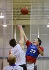 Michael Kelly, sophomore engineering major, reaches for the toss up during an intramural basketball game at West Baptist Jackson Church. - Photo by Jacob Moore