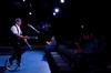 Guest artist Doug Berky juggles and rides a unicycle as a part of his performance of "No Show"  in the W.D. Powell Theatre.  - Photo by Anne Richoux
