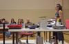Ceramicist Christa Assad, named 2012 Ceramic Artist of the Year, demonstrates her pottery to students and faculty of the art department.  - Photo by Olivia Wallace