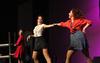 Anna Marie Deschenes, playing Ms. Hannigan, Katy Parks, playing Grace Farrell, and Shayla Smith, playing Annie, act in the Chi Omega performance during the 16th annual Variety Show at the Carl Perkins Civic Center - Photo by Matt McDaniel