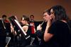 From right, Rachel Robbins, junior music and psychology major, and Andrew Hamaker, junior English major, perform in the symphonic band concert. - Photo by Anne Richoux
