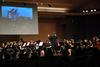 Michael Mann, assistant professor of music, conducts the symphonic band as they play a tribute to the Joplin, Missouri tornado during their Spring concert. - Photo by Anne Richoux