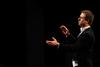 Chris Mathews, associate professor of music and department chair, conducts during the Spring Choral Concert at First Baptist Church.  - Photo by Anne Richoux