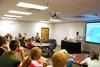 Tyler Glodjo, intercultural studies graduate student, presents his research project during the 10th annual Scholarship Symposium. - Photo by Anne Richoux