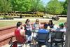 A class meets outside on the Barefoots Joe patio during a beautiful, sunny day.  - Photo by Anne Richoux