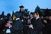 Rachel Carbonell, shows surprise and excitement as she makes her way to the stage to receive the Tigrett Medal during Spring Graduation.  - Photo by Anne Richoux