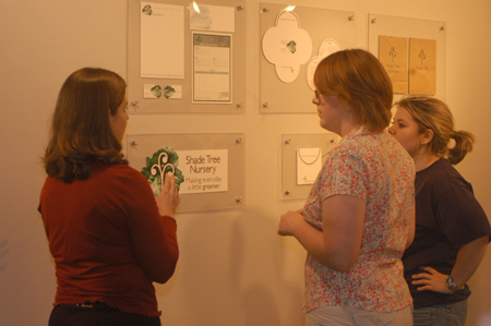 Senior Carrie Brooks discusses some of her graphic design in the Art Gallery.