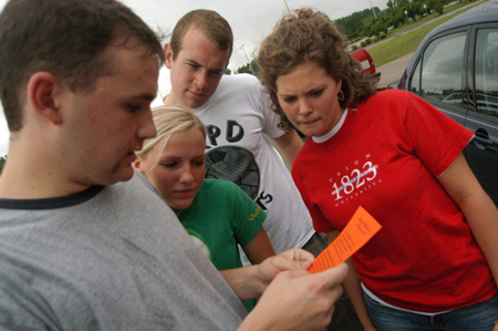Brett Jenkins, Ashley Cherry, Wayne Campbell, and Lauren Oldham read the next route clue during the Watters Amazing Race.